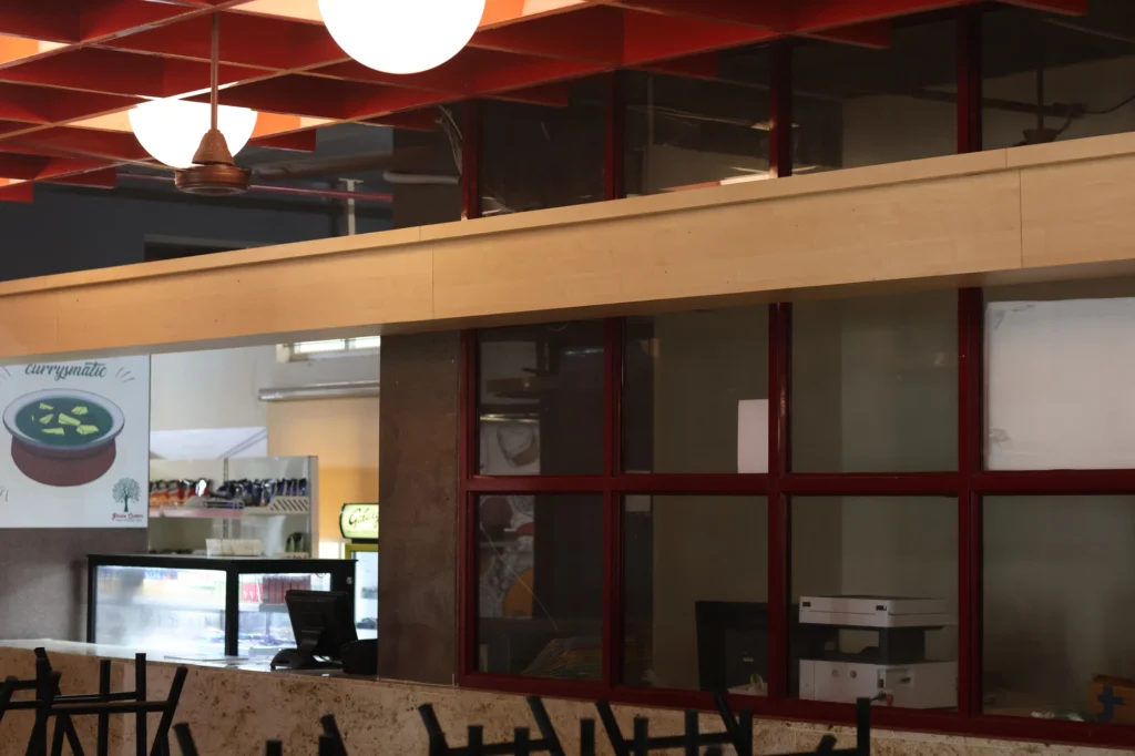 As built — globe canopy and community caricature mural