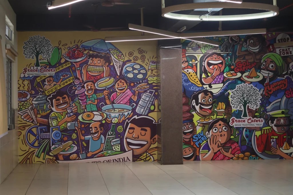 As built — the hand-painted “Streets of India” mural in the finished hall