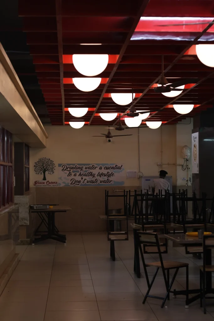 As built — the glowing red-batten ceiling over the Grace Caters tree mark