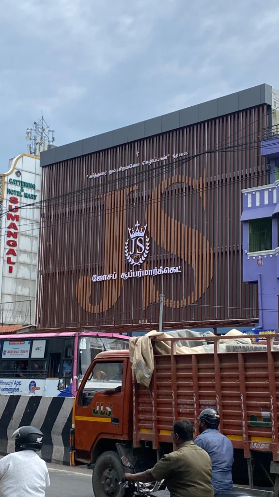 Across the road — the three-storey veil among its neighbours