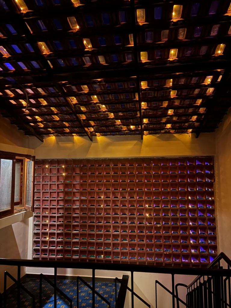 Courtyard skylight — glass-terracotta tiles lit at night over the stair hall